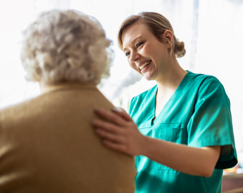 Smiling female provider and an older female patient