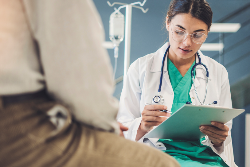 Female provider looking at a medical chart