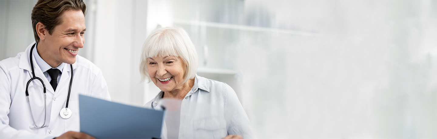 provider and woman look at a document