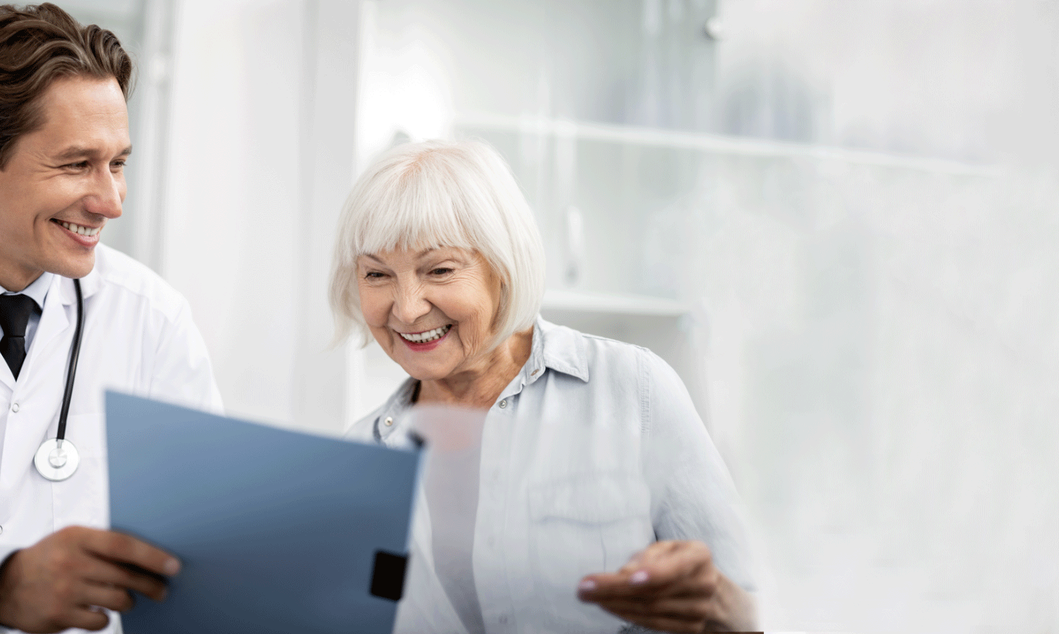 provider and woman look at a document