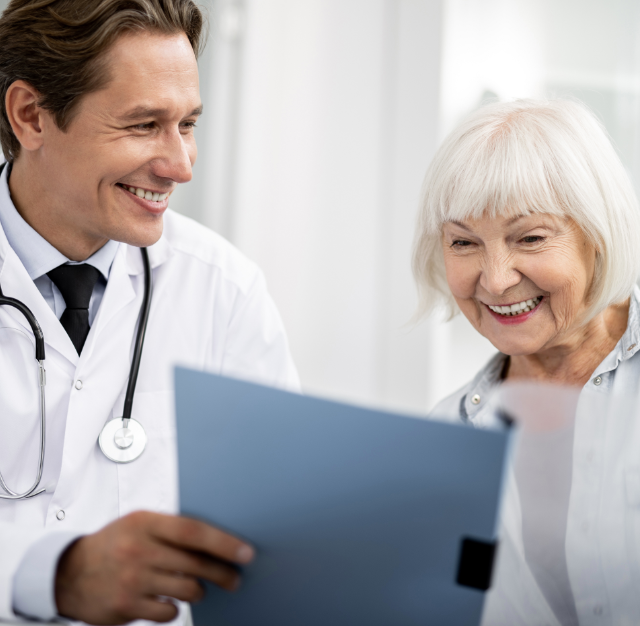 provider and woman look at a document